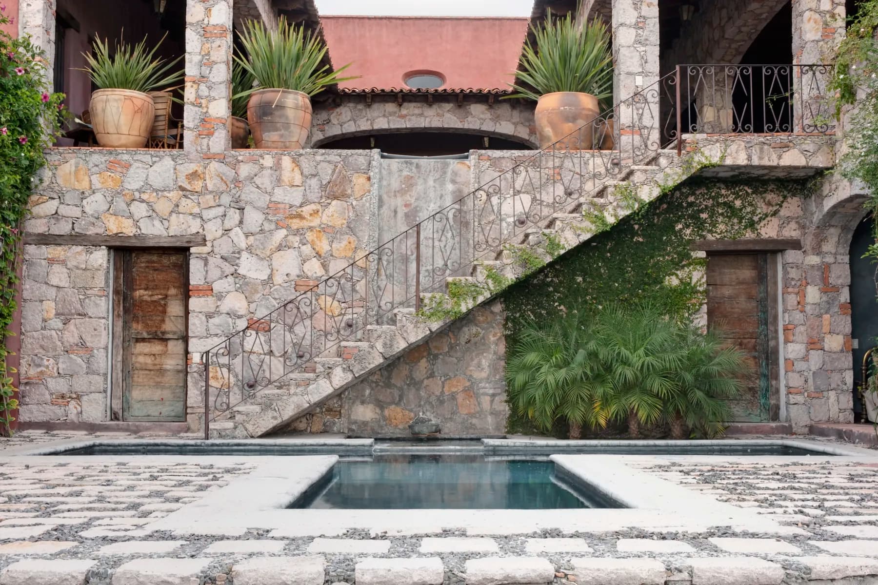 Stone courtyard with a plunge pool at a boutique property